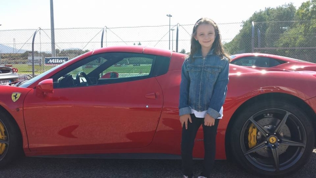  With a beautiful Ferrari 