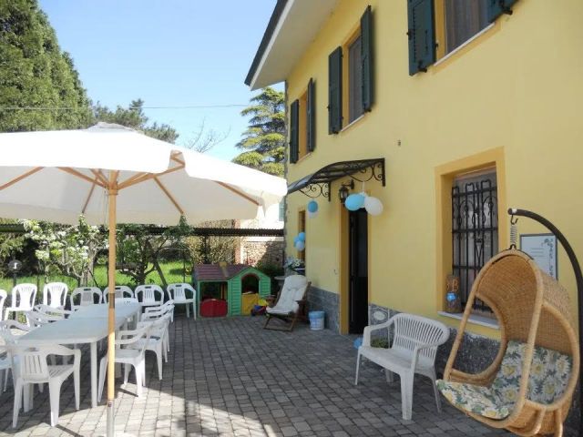  The courtyard with the umbrella and the hanging chair 