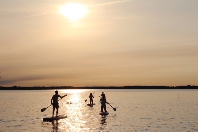  Paddle surfing at sunset