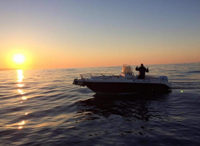  on a boat at sunset 