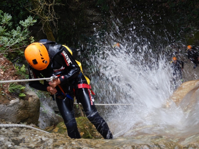  Downhill with rope among the natural waterfalls 