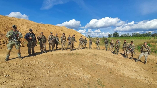  A team prepares for its airsoft game 